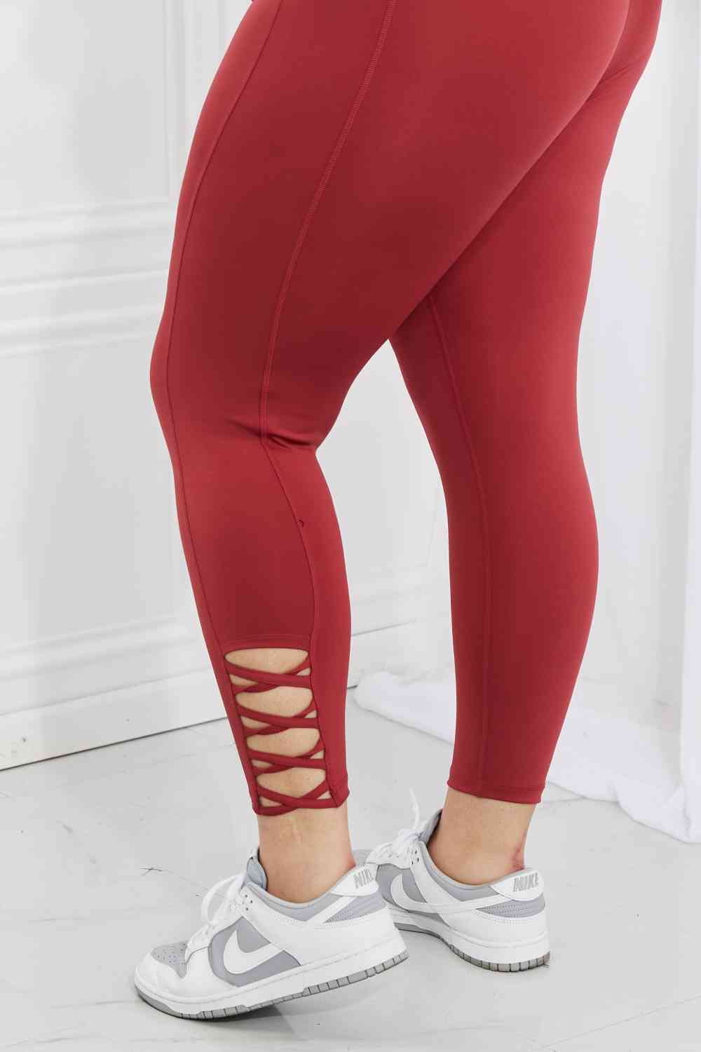 Yelete Ready For Action Full Size Ankle Cutout Active Leggings in Brick Red BLUE ZONE PLANET