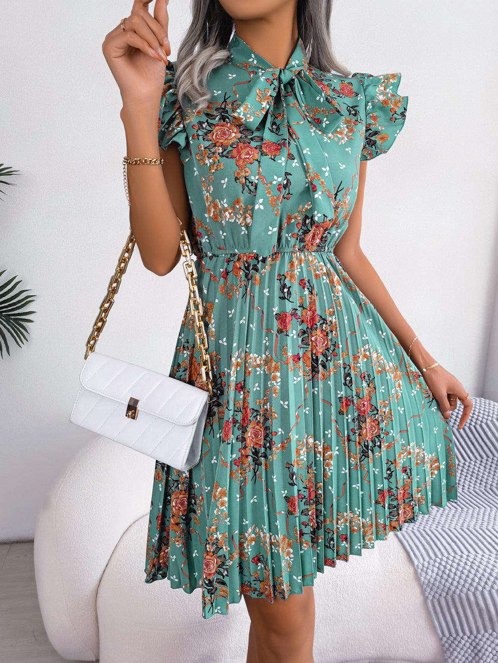 Pleated Floral Printed Tie Neck Knee Length Dress - Blue Zone Planet Pleated Floral Printed Tie Neck Knee Length Dress - Blue Zone Planet